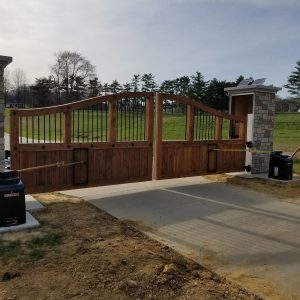 Photo of wood and metal swing gate with operator