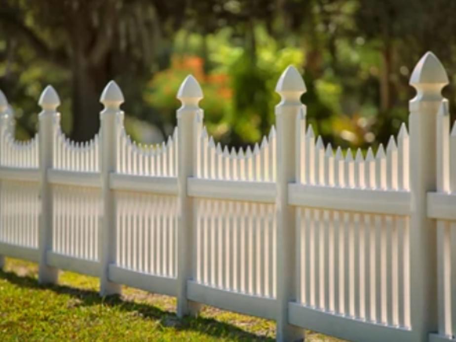 Photo of a white, vinyl picket fence