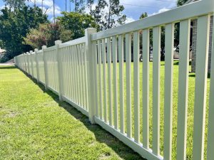 Photo of a white vinyl picket fence