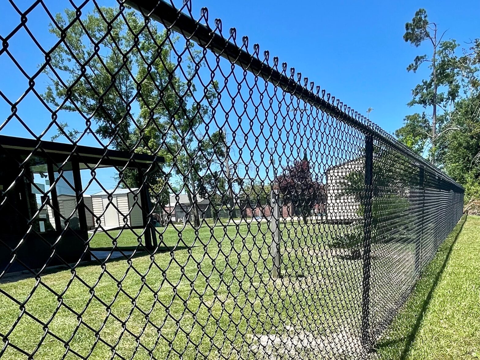 Photo of a vinyl coated chain link residential fence in Panama City, FL